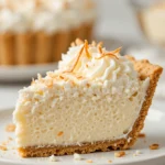 Coconut Cream Pie 3 Slice of creamy coconut cream pie with whipped cream and toasted coconut topping