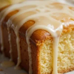 Lemon Drizzle Cake 3 Close-up of moist lemon drizzle cake with shiny glaze