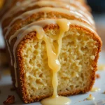 Lemon Drizzle Loaf 3 Close-up of moist lemon drizzle loaf with glossy lemon glaze