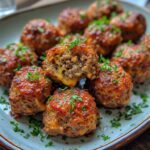 Cheesy Stuffed Meatloaf Bites Recipe 5 Close-up of Cheesy Stuffed Meatloaf Bites with melted cheese