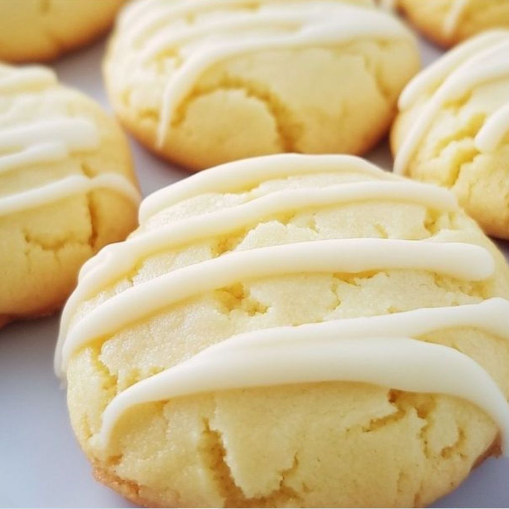 Close-up of soft Lemon Cheesecake Cookies with a creamy center and lemon zest garnish