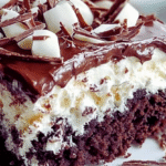 Mounds Poke Cake 3 Slice of Mounds poke cake with chocolate ganache and shredded coconut
