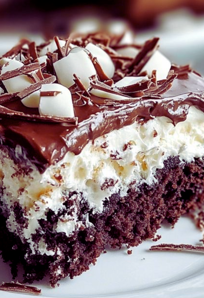 Slice of Mounds poke cake with chocolate ganache and shredded coconut